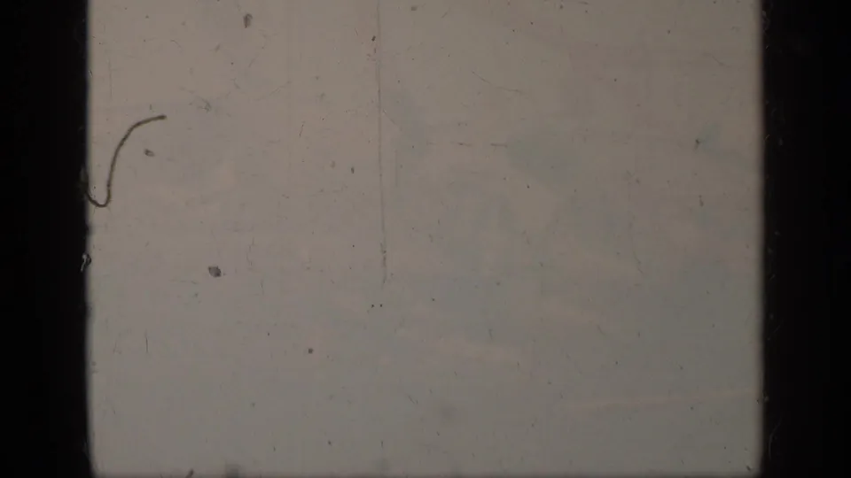 The final 1963 8mm frame is overexposed and faded, with only faint outlines of the carrier-deck scene visible.