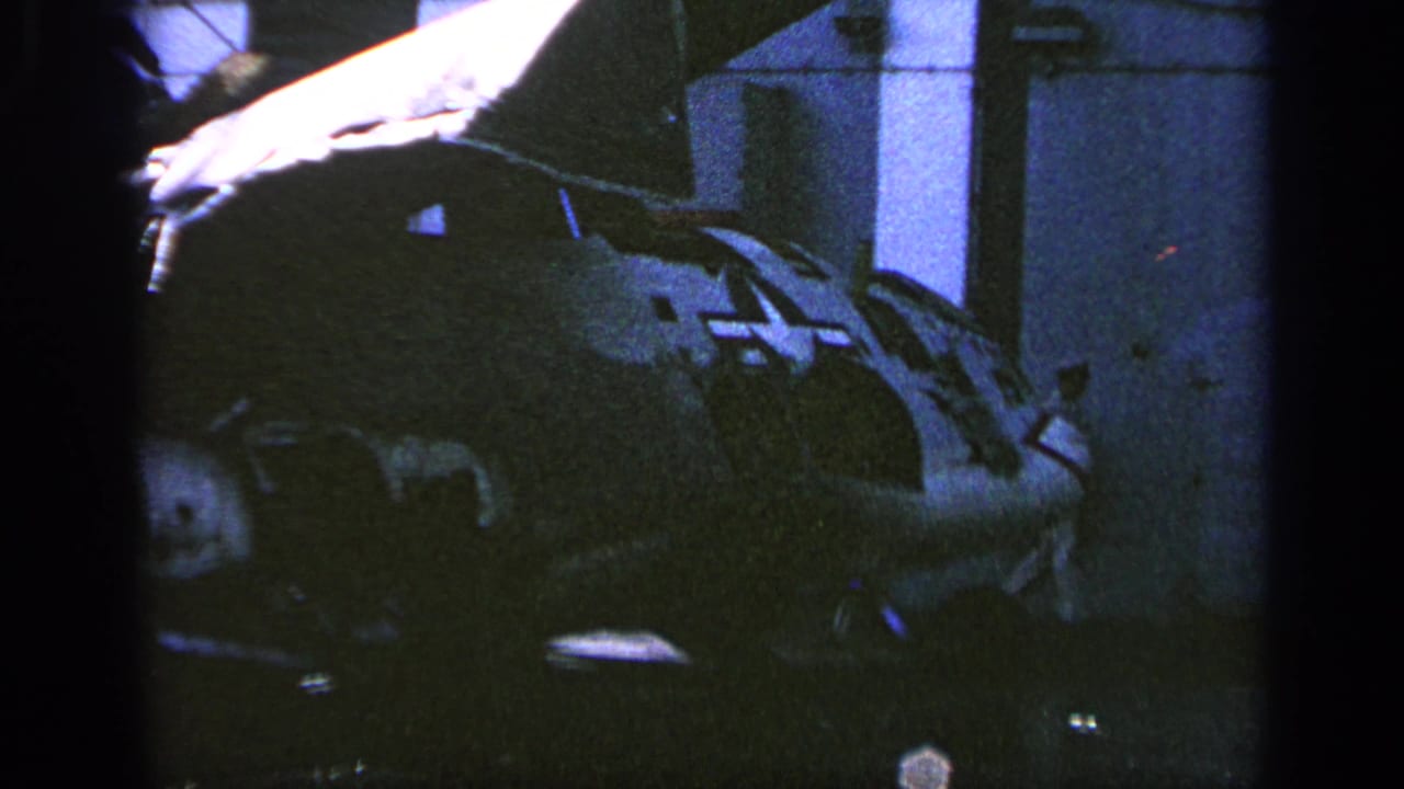 Dark close view of a damaged military aircraft section with star insignia.