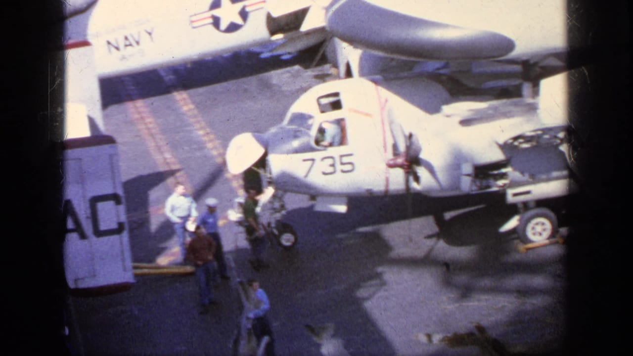 White aircraft numbered 735 with personnel standing nearby on the tarmac.