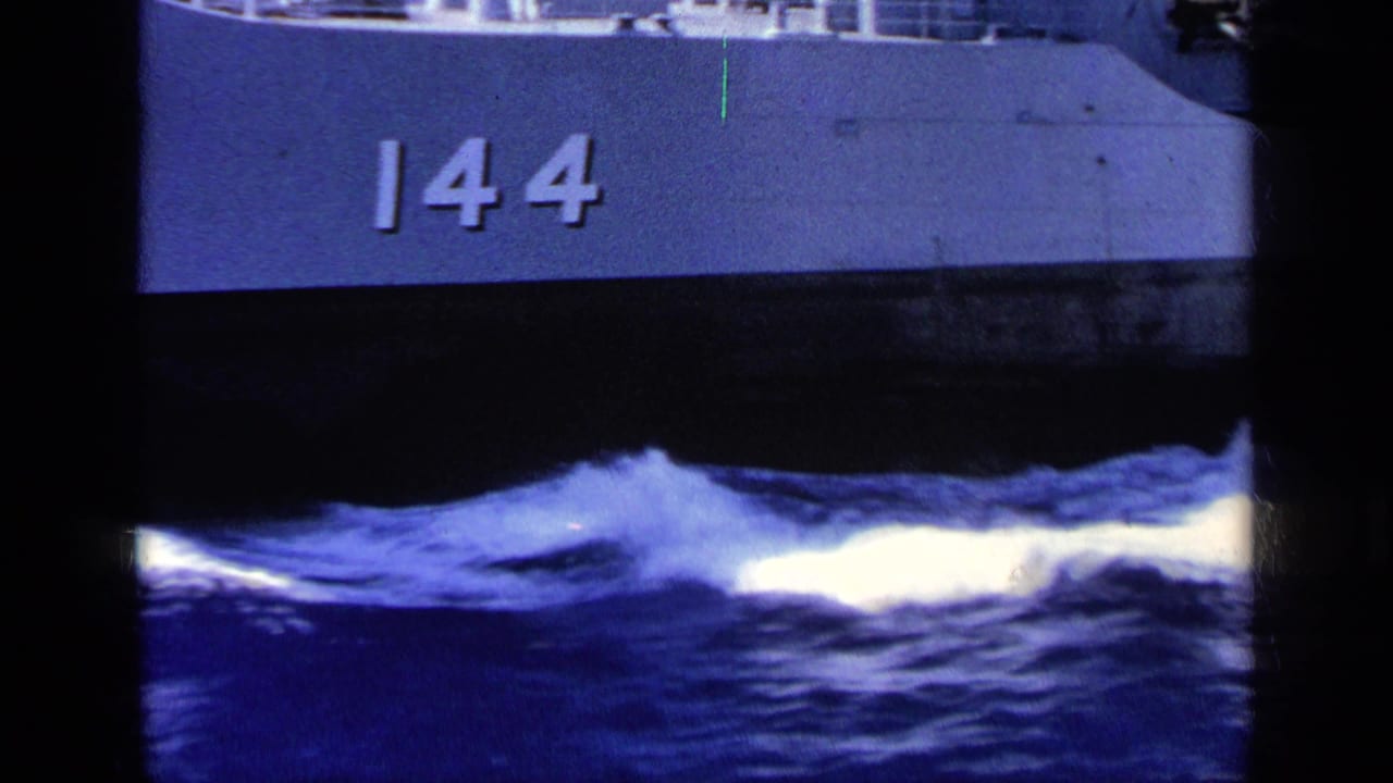 Ship hull marked 144 above choppy blue water.