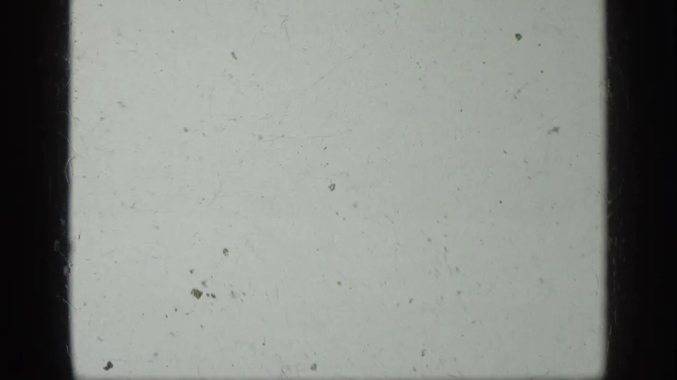 Blank leader section in the 1963 Greece home-movie scan, with pale color, dust, and a dark vertical frame edge.