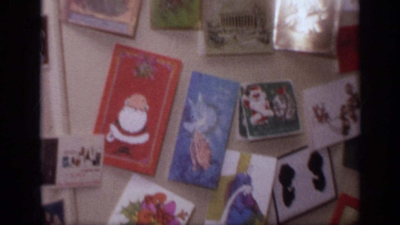 1968 California home interior showing a refrigerator covered with holiday greeting cards, magnets, and illustrated paper cards.
