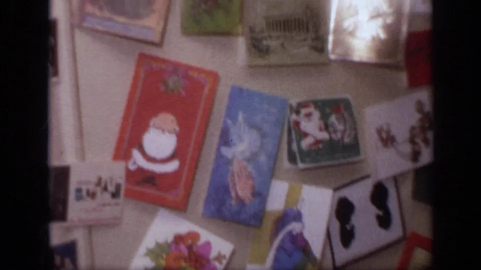 1968 California home interior showing a refrigerator covered with holiday greeting cards, magnets, and illustrated paper cards.