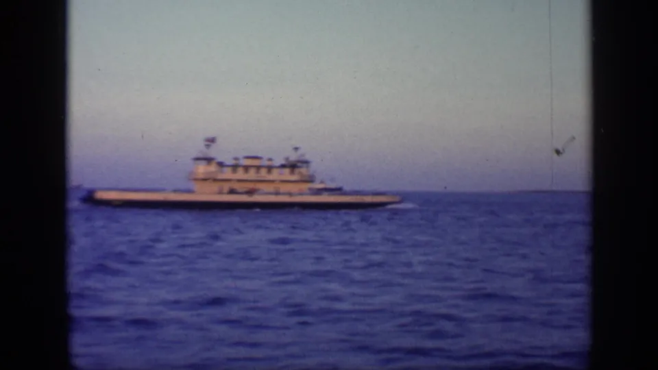 1968 Florida 8mm frame showing the white vessel more centered against blue ocean water, with visible film-frame edges.
