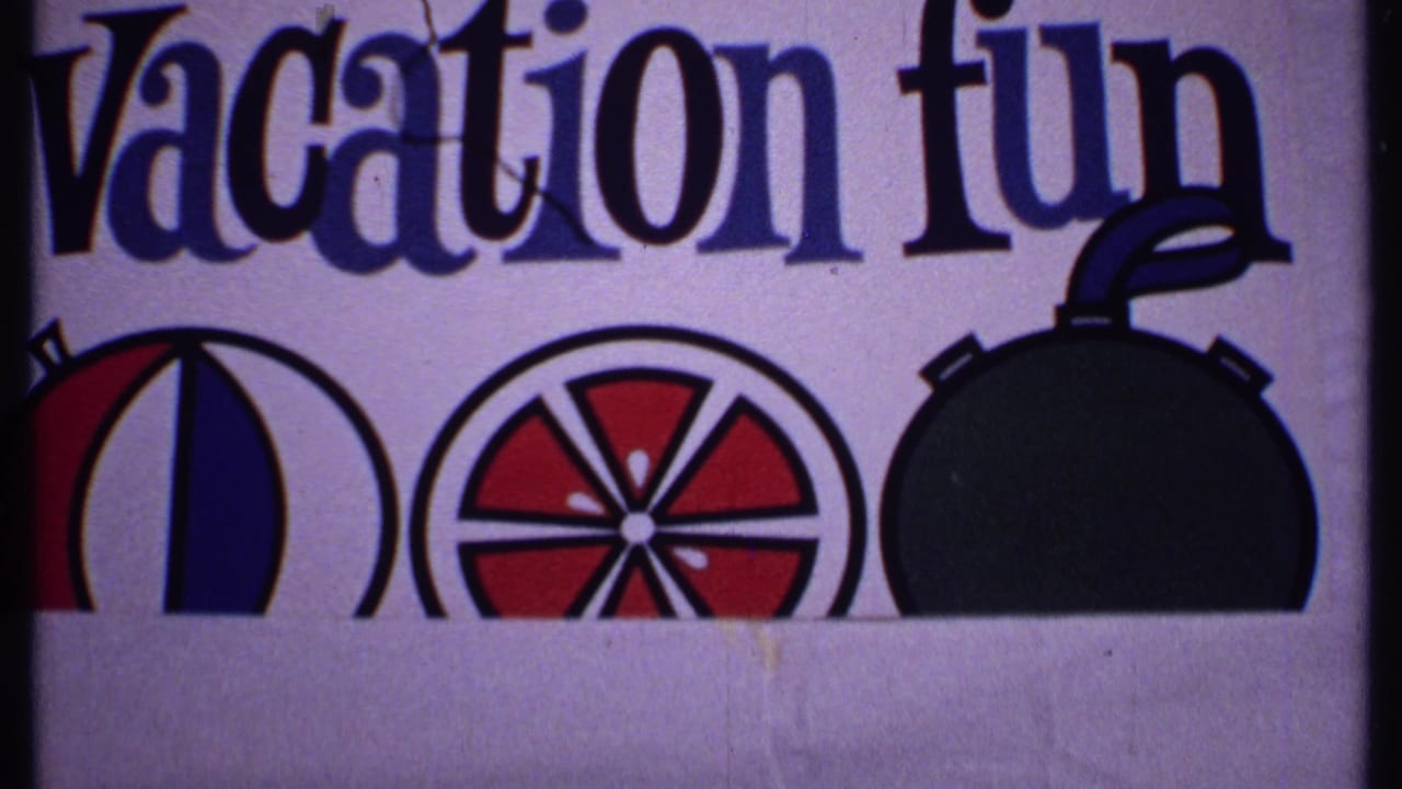 Close view of a printed vacation advertisement with the words "Vacation fun" and colorful circular graphics.