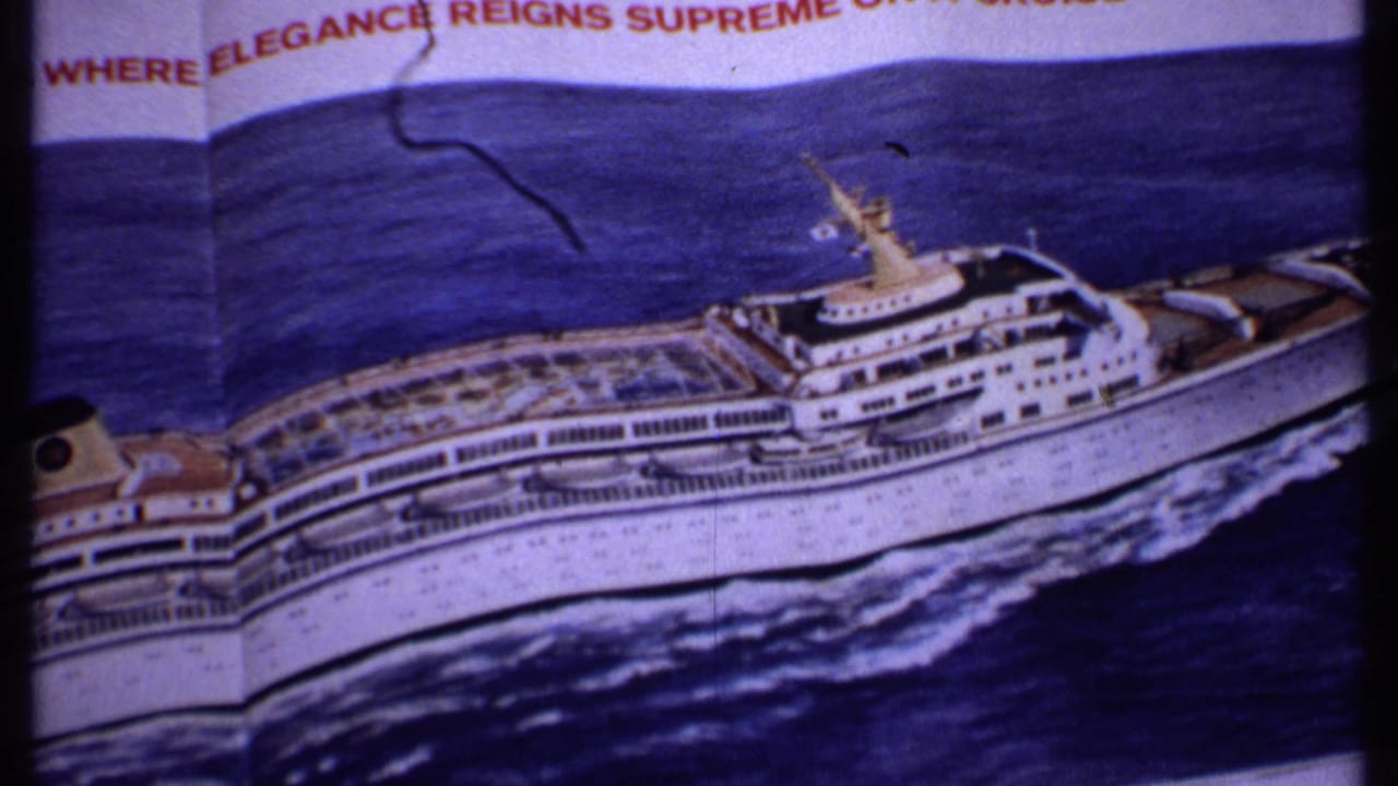 A Bahamas 1969 8mm frame records a printed cruise liner illustration, partial slogan text, blue ocean artwork, and visible film wear.