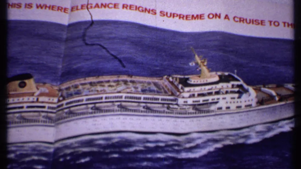 1969 Bahamas reel frame showing a printed cruise ship illustration on deep blue water with partial red promotional text above.