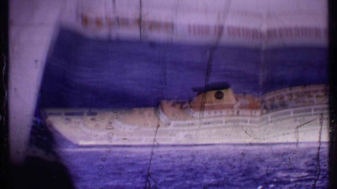 Printed or reflected Oceanic ship view with sea and a large dark foreground shape.