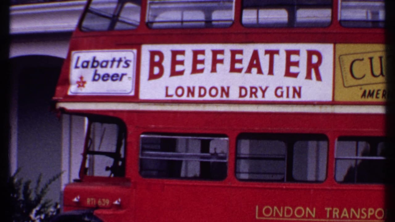 Red double-decker bus with Beefeater, Labatt's beer, and Cutty Sark advertisements.