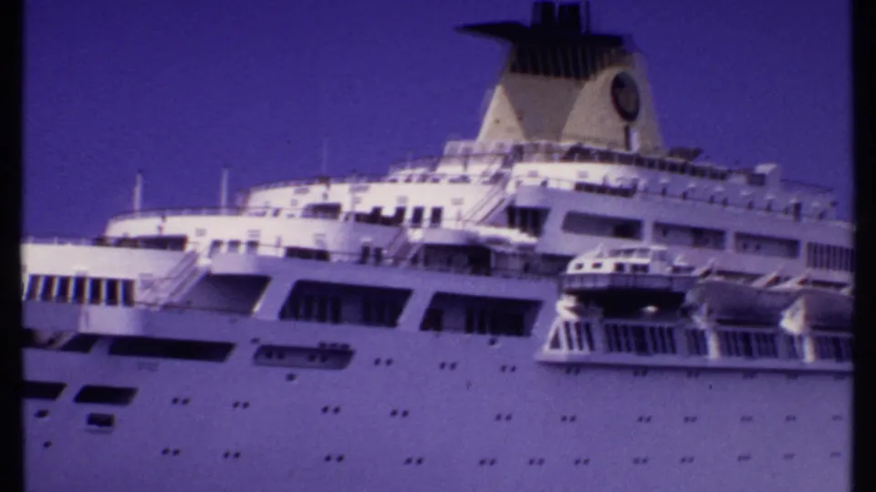 1969 Bahamas close view of the cruise ship's midsection, with funnel, bridge area, lifeboats, and rows of hull windows.