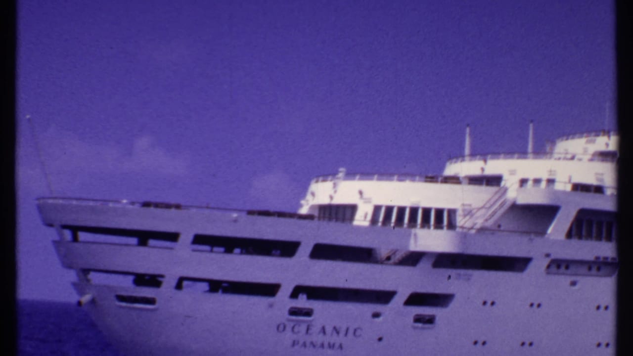 White cruise ship bow at sea with the name Oceanic Panama visible.