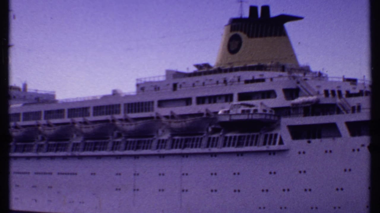 White cruise ship side with lifeboats, funnel, portholes, and purple dusk sky.