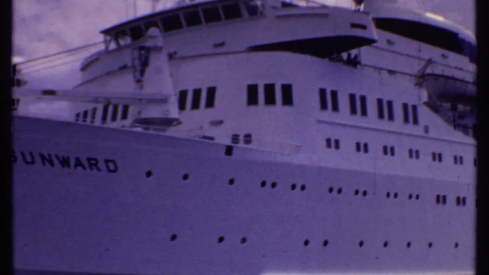 Close view of the Sunward bridge area and upper hull, with windows, portholes, and lifeboat equipment visible.