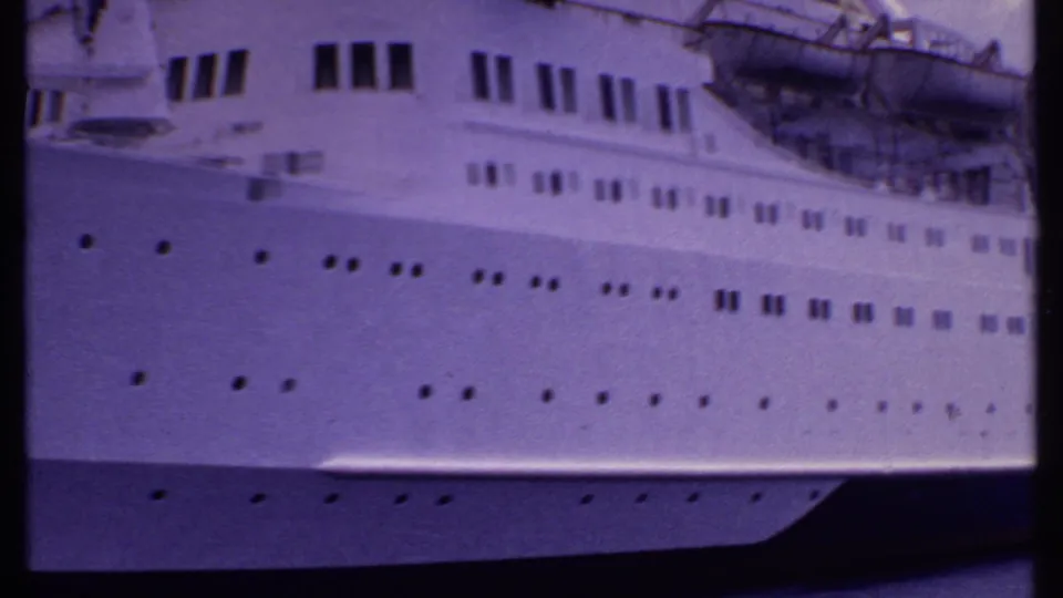 Wider 1969 Bahamas view along the side of the Sunward, showing bridge windows, rows of portholes, and lifeboats above the hull.