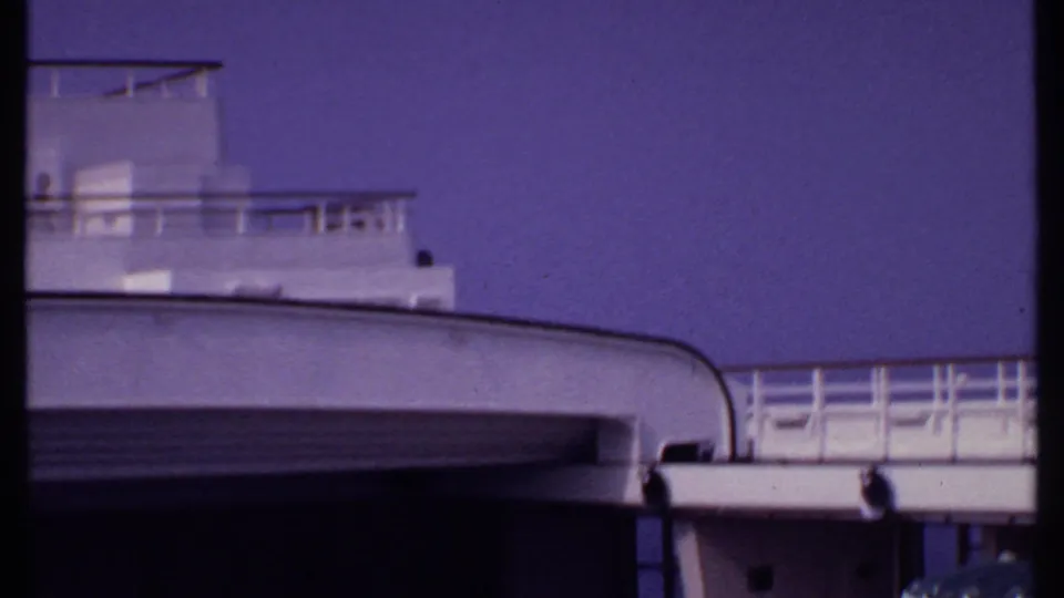 Bahamas 1969 frame showing the cruise ship's rounded white deck edge, railings, and upper structure during a pan.