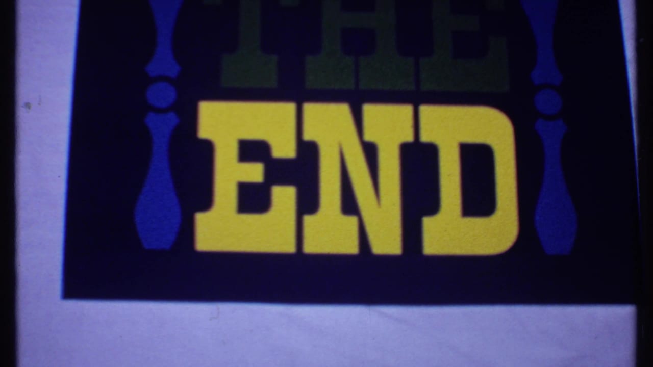 THE END title card with yellow lettering on a dark blue field and white border.