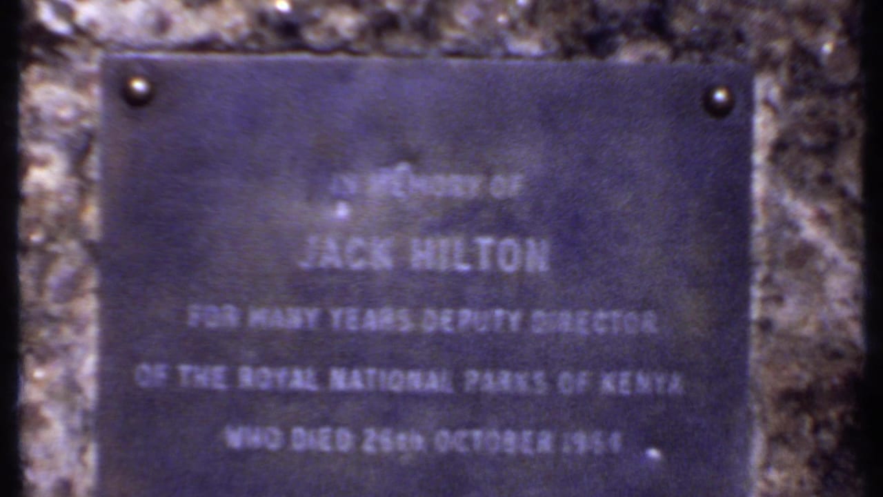 Stone-mounted memorial plaque with soft white lettering.