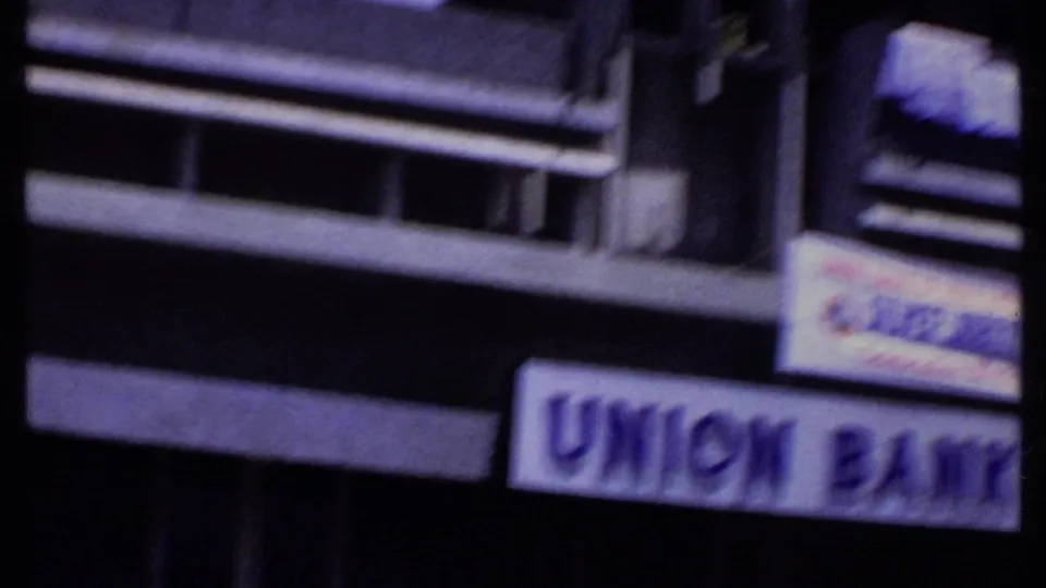 1969 Kenya frame with motion-softened commercial frontage and a readable Union Bank sign near the lower right.