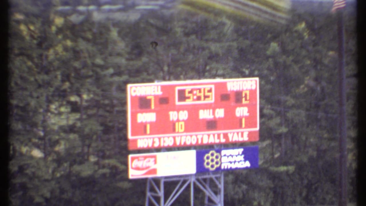 Zoomed view of a red football scoreboard reading Cornell 7 and visitors 0.