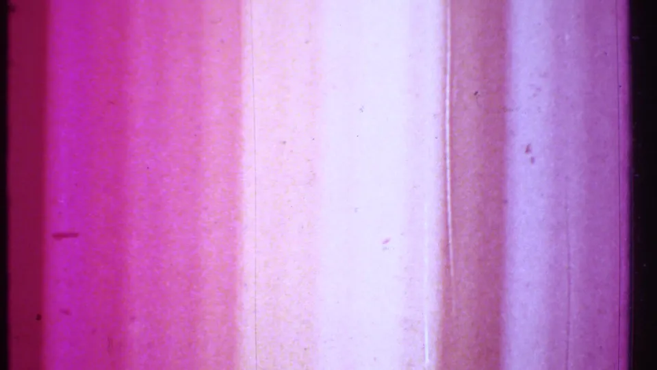 Pink-purple analog film leader appears at the end of the 1979 8mm clip, with vertical bands, dust, and scan texture visible.