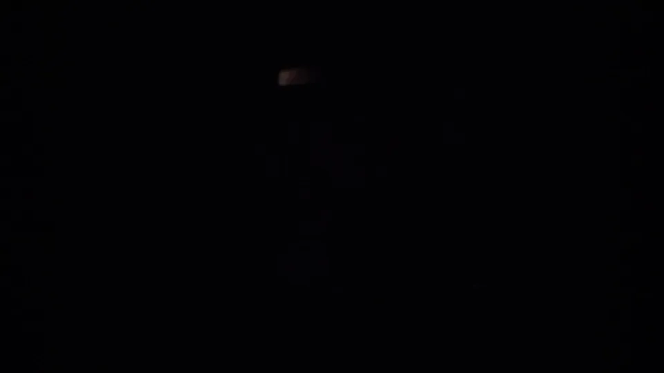 End frame from the 1959 Ohio 8mm clip, mostly black with faint film marks and little visible scene detail.