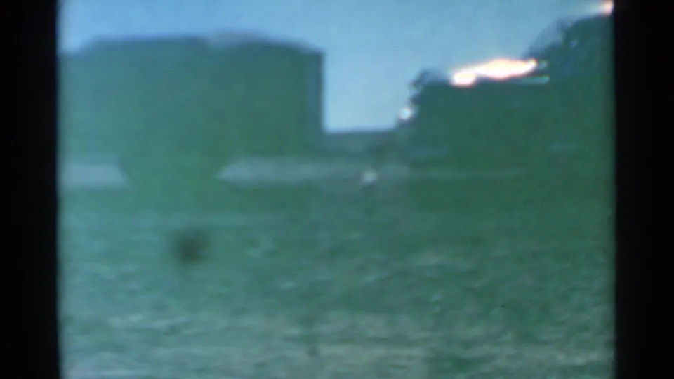 In the final 1959 South Dakota frame, the dog is faint near the lower field while the parked vehicle remains at right.