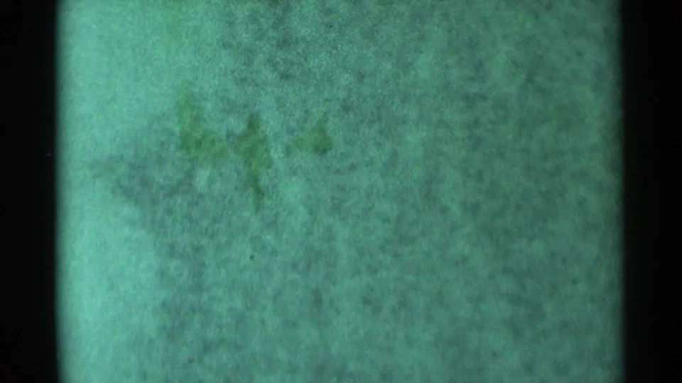 Obscured 1959 South Dakota 8mm storm footage with blue-green cast, heavy grain, and no identifiable people or property.