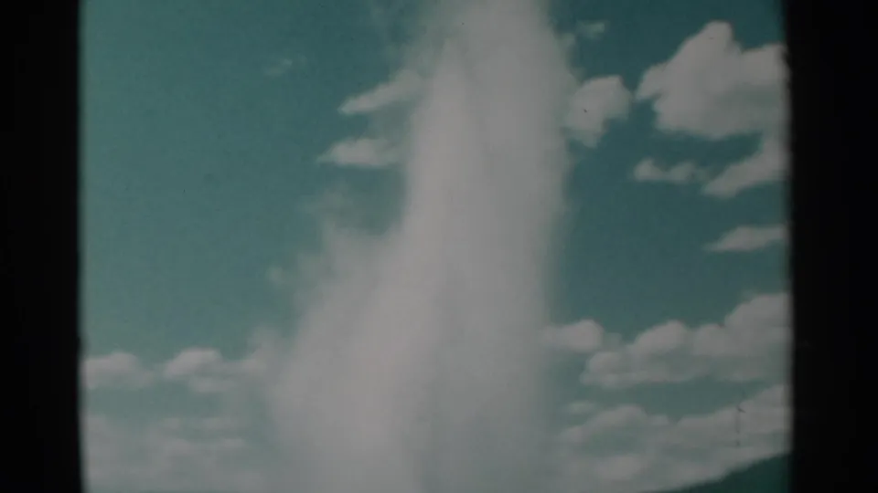 The plume thins and bends as it rises, with the supplied metadata identifying the clip as 1961 Wyoming home-movie footage.