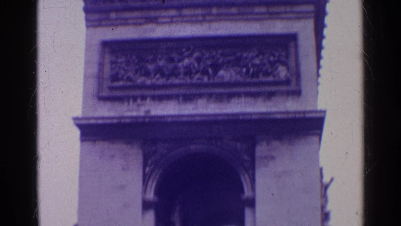 Close view of the Arc de Triomphe arch opening and upper relief panel.
