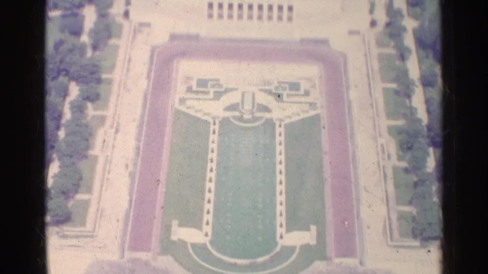 High 1961 Paris view of a symmetrical formal garden with green lawns, pale walkways, and a central fountain or monument.