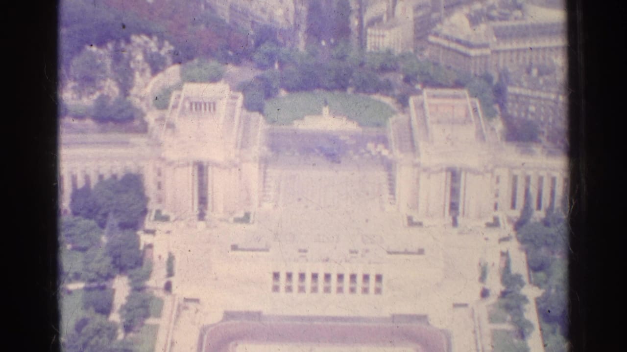 Aerial view of a formal colonnaded building and courtyard in Paris.
