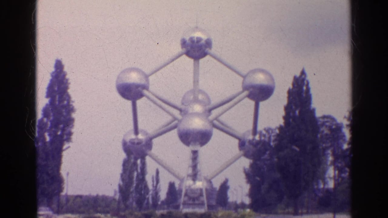 Atomium landmark framed by trees with soft 8mm focus.