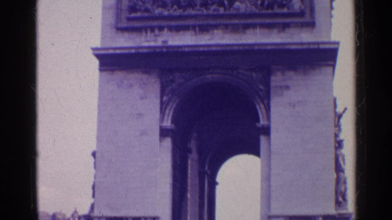 The final frame holds on the historic stone arch, showing its large central opening, sculptural side detail, and soft 8mm color shift.