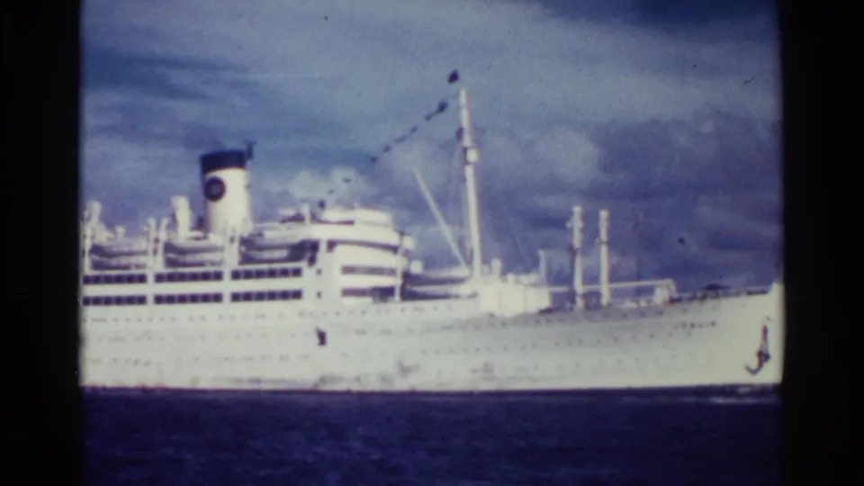 The final frame shows the rear half of the white liner, with one main funnel, lifeboats, mast rigging, blue sea, and mottled cloud cover.