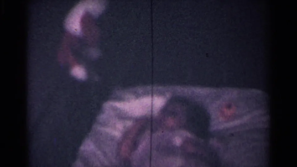 A blurred close view catches the bicycle basket and part of the rider as the camera follows the movement.