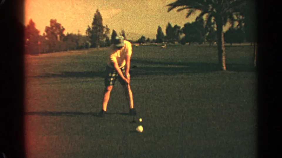 A 1968 Scottsdale golf-course view shows the golfer pausing with his club near the ball and palms in the background.