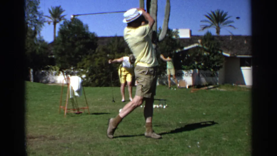 The 1968 backyard golf scene shows the man mid-follow-through, with golf balls on the grass and two background figures near the house.