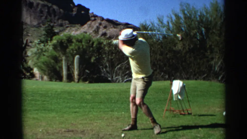 The 1968 Scottsdale golf footage shows the man rotating through the early swing, framed against cacti, shrubs, and rocky desert hills.