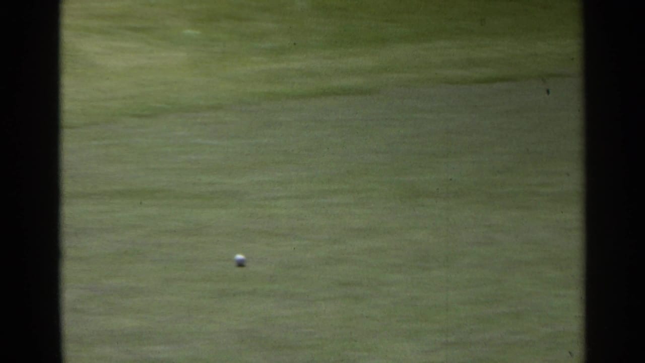 A golf ball travels over the green in the 1968 Scottsdale home-movie footage, with the golfer out of frame.