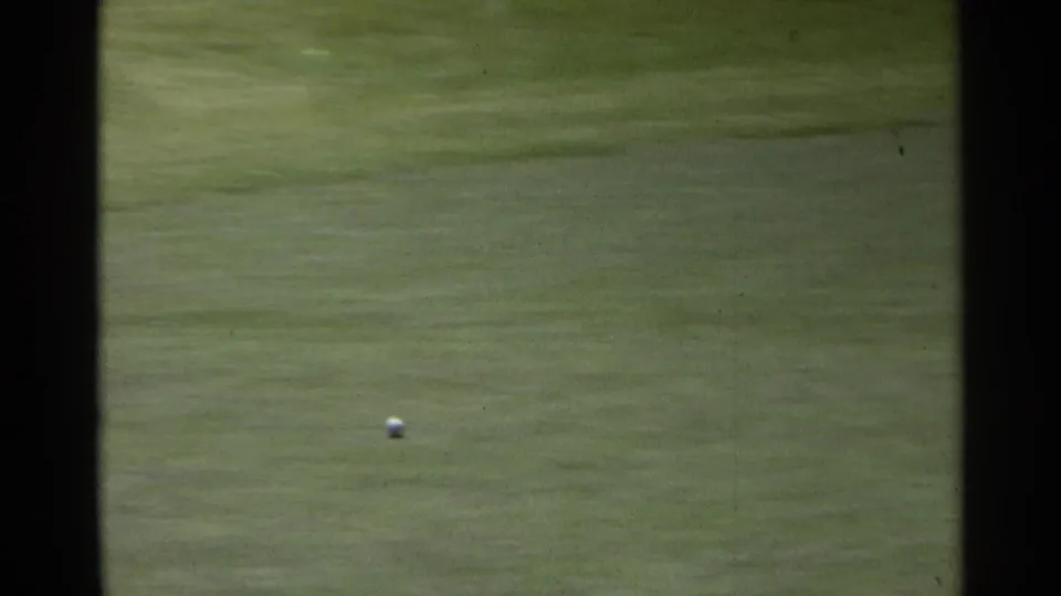 A golf ball travels over the green in the 1968 Scottsdale home-movie footage, with the golfer out of frame.