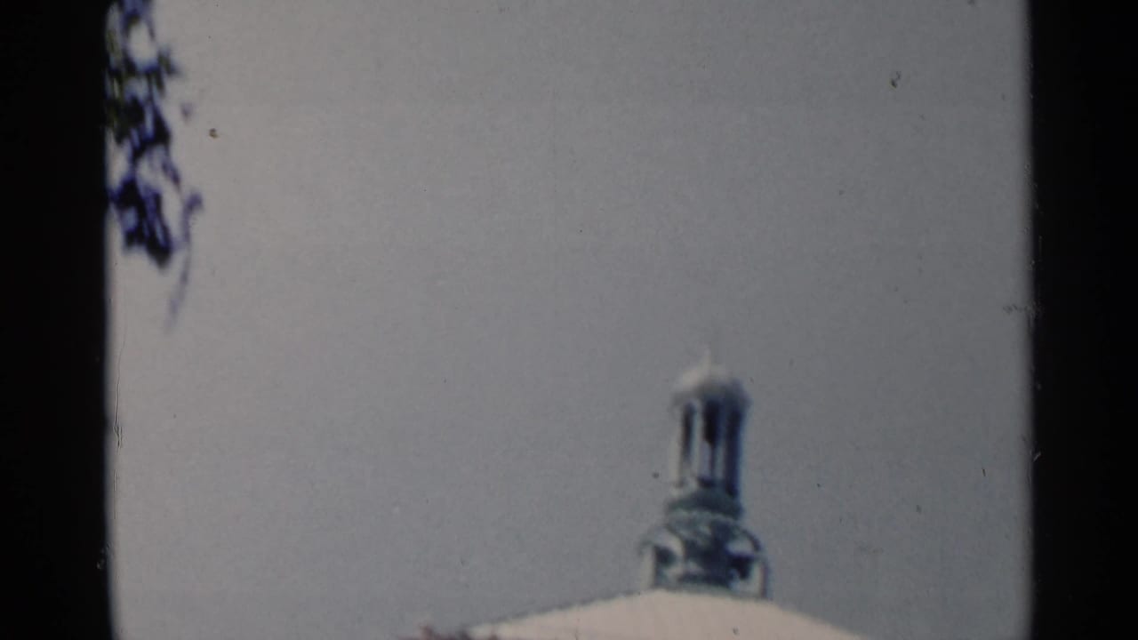 Partial pale structure with a small monument-like detail at the lower edge.