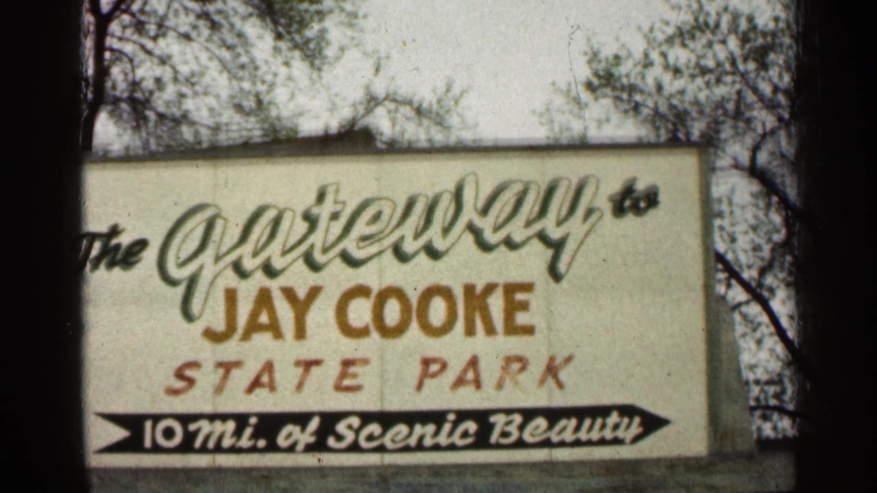 Jay Cooke State Park entrance sign beside trees.