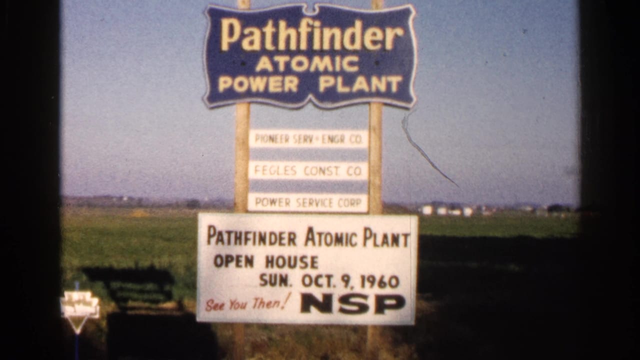 Roadside Pathfinder Atomic Power Plant open-house sign in a field.