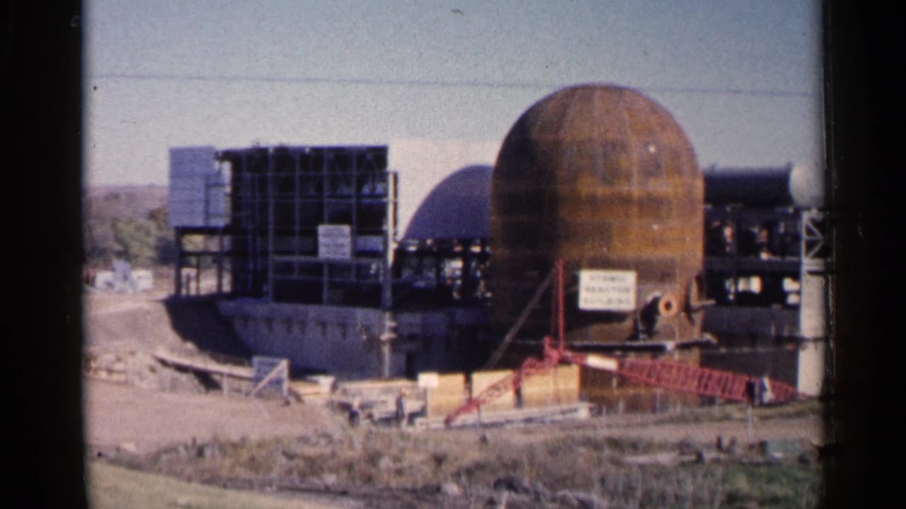 Sioux Falls construction footage from 1960 showing a spherical nuclear-facility structure beside steel framing and a darker dome-like form.