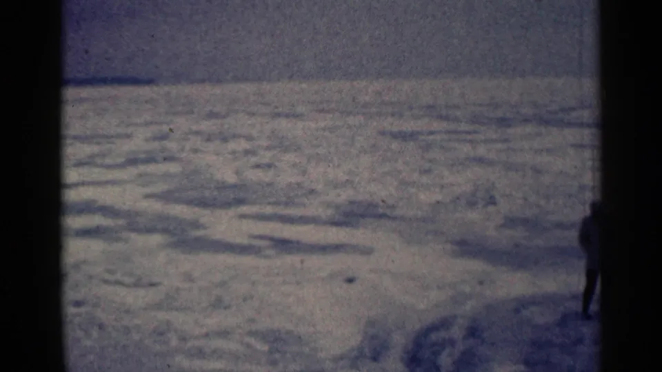 The final frame catches the figure partly cropped at the right edge, leaving the snow-covered Duluth landscape dominant.