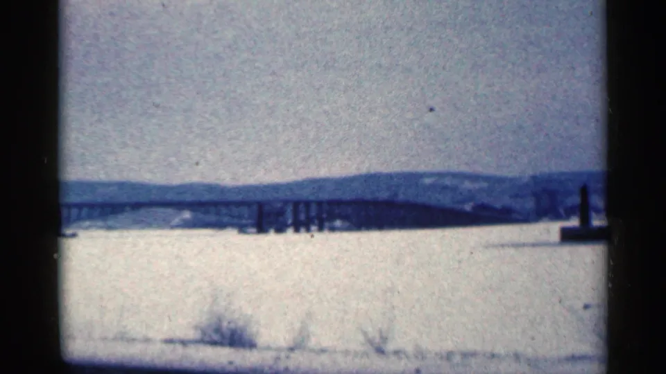 The final frame shifts to a snow-covered Duluth-area landscape with distant hills and a bridge or pier-like structure across the middle distance.
