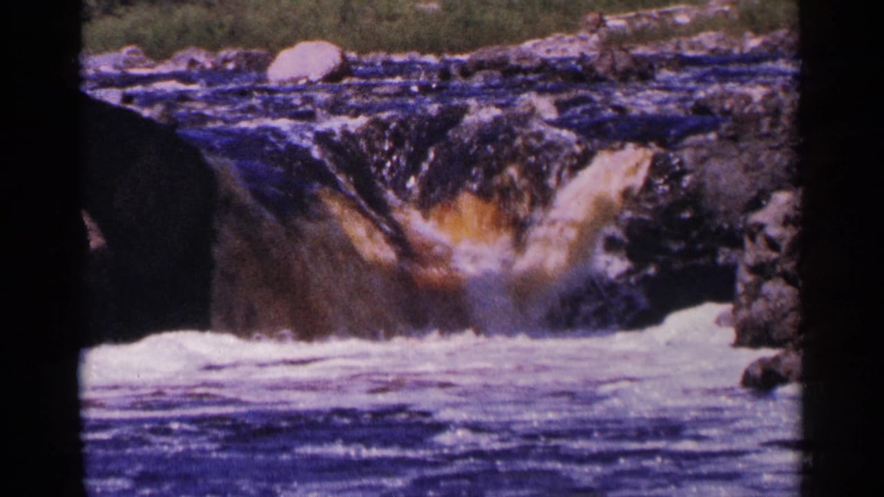 Rocky waterfall dropping into foaming water with dark 8mm frame edges.