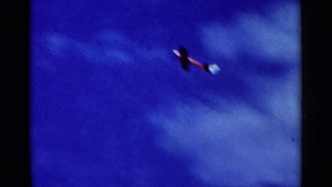 The aircraft has lifted into the blue sky, its wings banking slightly in the final 8mm frame of the takeoff.