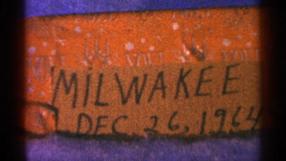Final 8mm frame repeats the handwritten Milwaukee Dec. 26, 1964 label with soft focus and visible gate edges.