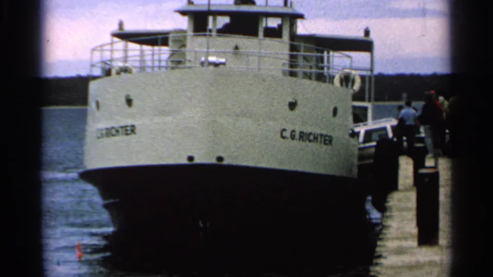The C.G. Richter ferry fills the frame as passengers wait or board at the Washington Island dock in 1964 home-movie footage.